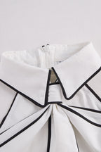 Stylish Sleeveless Halter Neck Blouse With Bold Contrast Trim