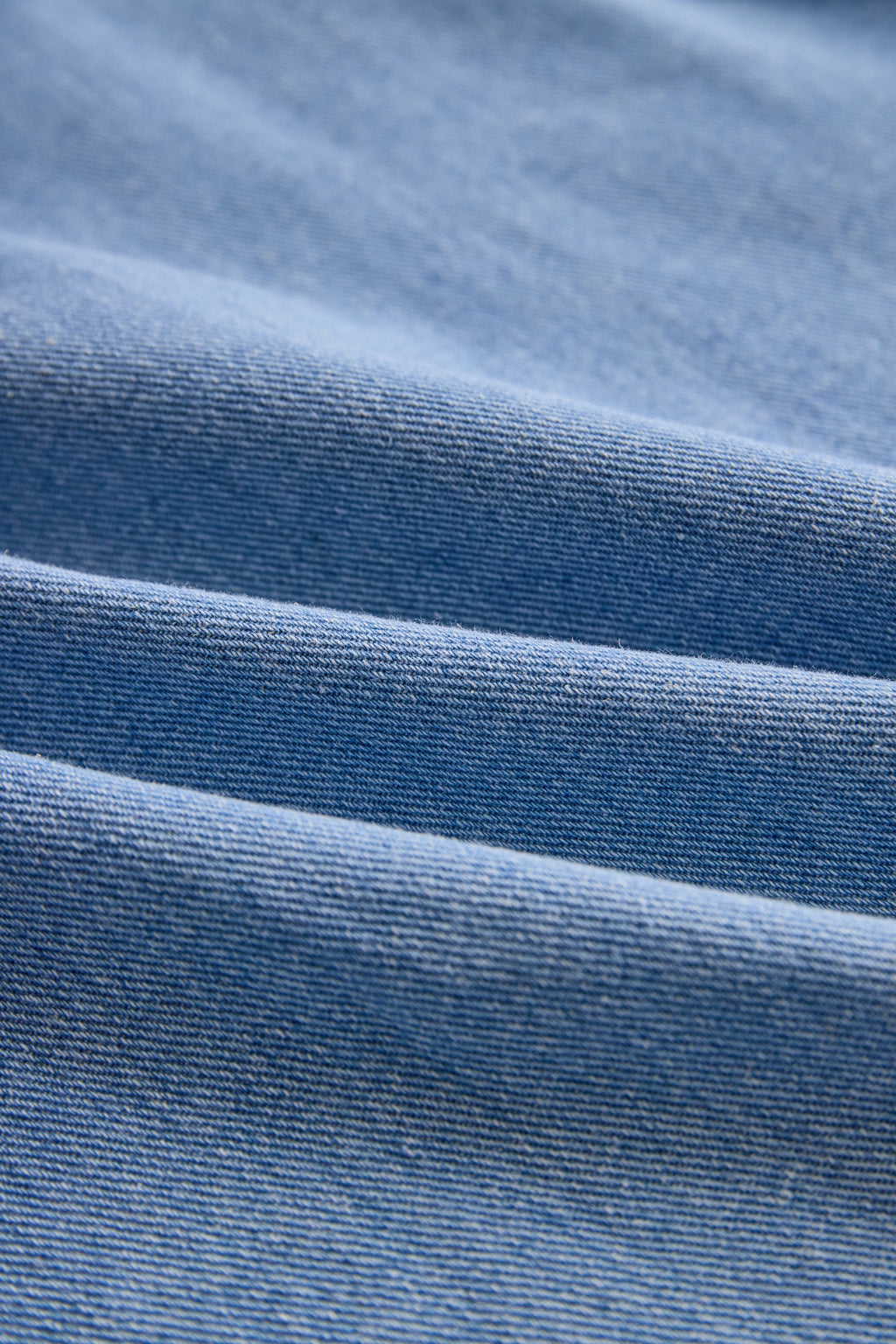 Stylish Denim Two-Piece Set With Asymmetrical Top And Fringed Skirt