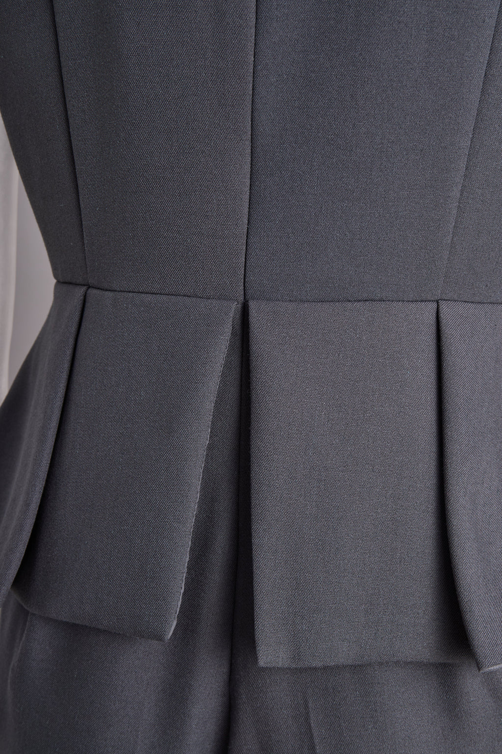 Sophisticated Sleeveless Peplum Jumpsuit In Charcoal Gray